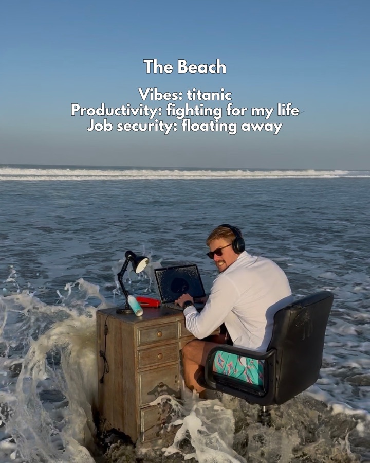 Scotty working at his desk in the ocean surf